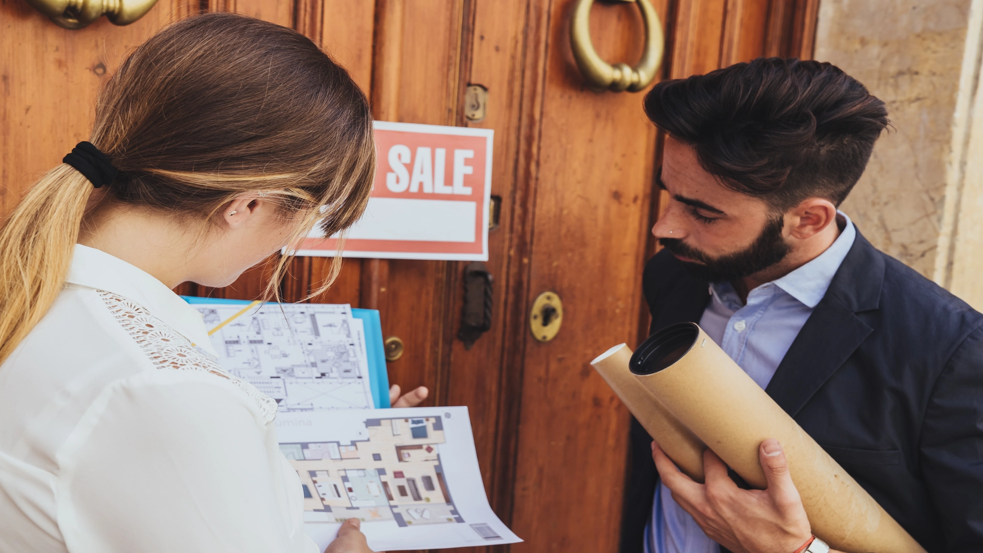 Buyer reviewing floor plans of a landlord’s tenant-occupied property.